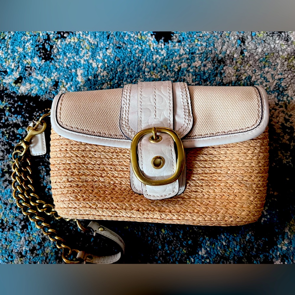 Wicker Coach wristlet with card slot inside.